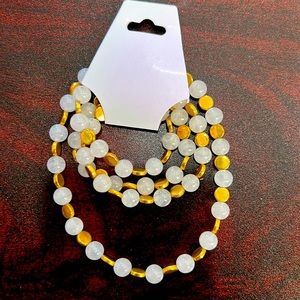 28 1/2in white belly chain with gold flat circle spacers